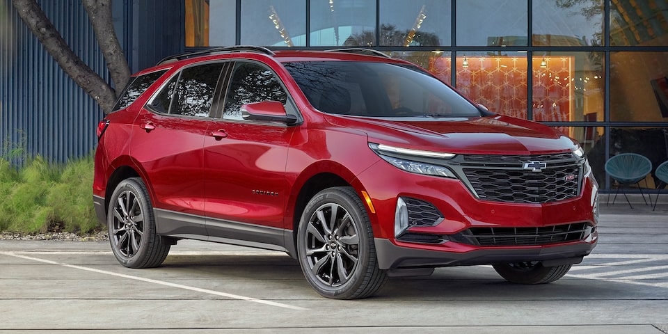 The 2023 Chevrolet Equinox RS parked outside a home.