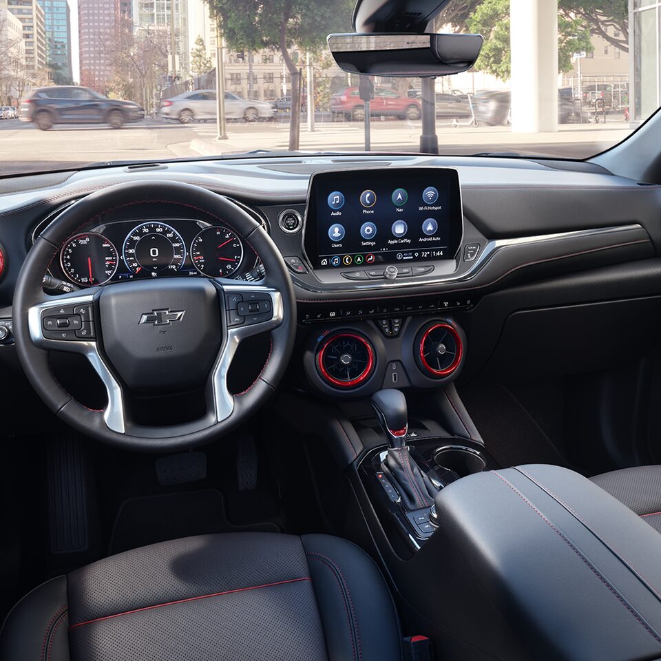 Closeup of front seats and infotainment system in the 2024 Chevrolet Blazer sporty mid-size SUV.