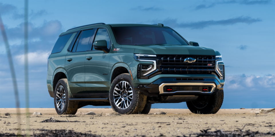 Front three-quarters view of the 2025 Chevrolet Tahoe SUV by the ocean.