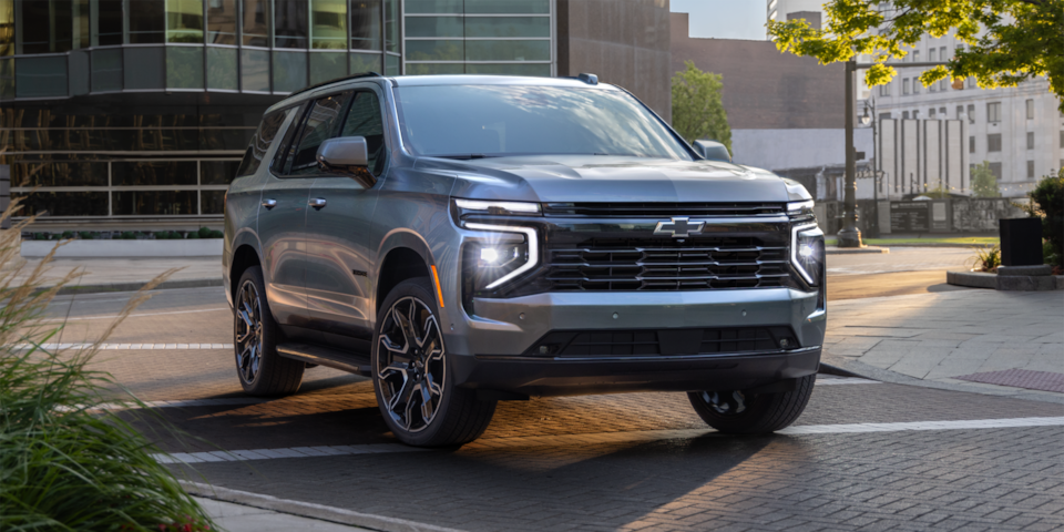 Front three-quarters view of the 2025 Chevrolet Tahoe in the middle of the city.
