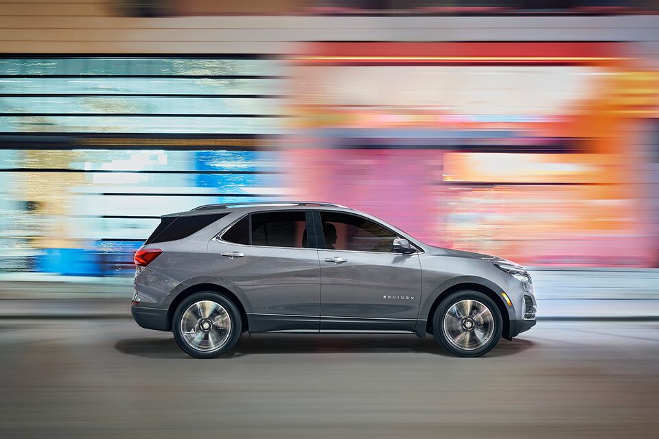 The 2024 Chevrolet Equinox driving ferociously fast in the city.