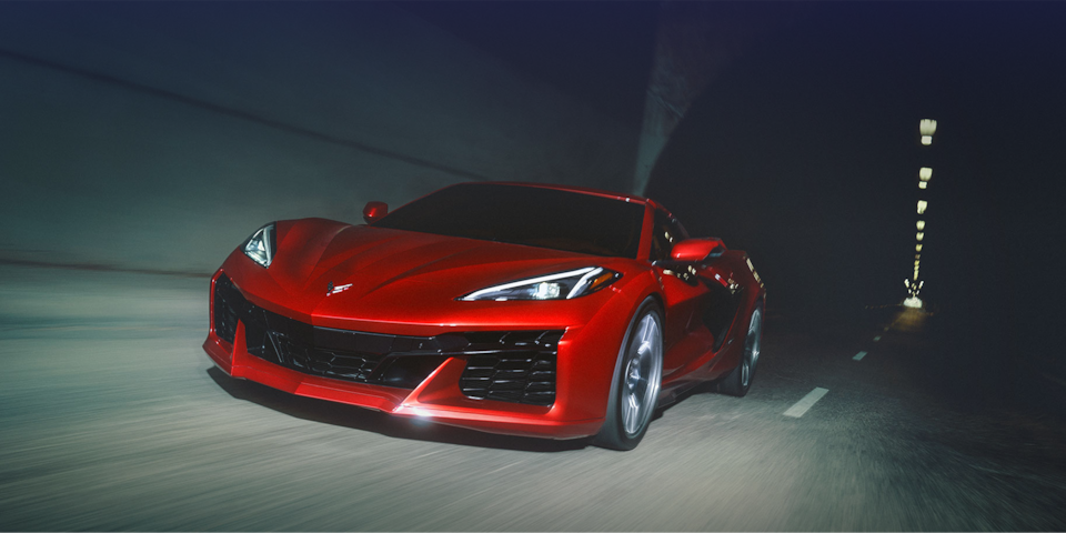 The Chevrolet Corvette Z06 exiting a tunnel while driving lightning fast.