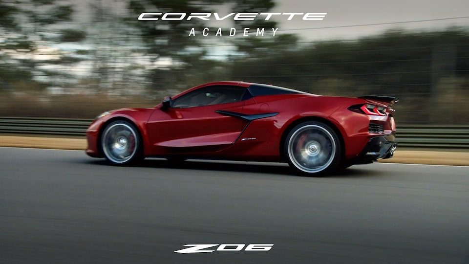The 2024 Chevrolet Corvette Z06 speeding on an open road.