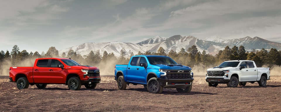 Three 2022 Chevrolet Silverado 1500 parked side by side.
