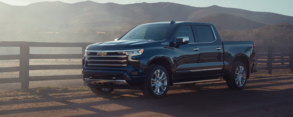 2022 Silverado 1500 High Country driving on a ranch.