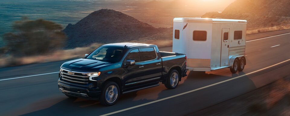 2022 Chevrolet Silverado 1500 pickup truck towing trailer.