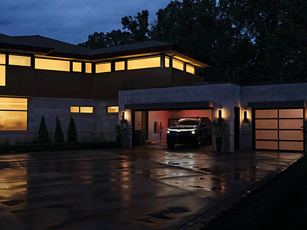 2024 Chevrolet Silverado EV parked in the garage of a modern home.