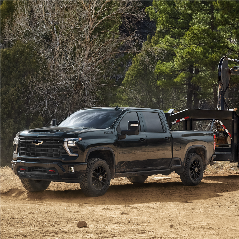 Chevrolet Silverado HD Trail Boss Towing Construction Equipment.