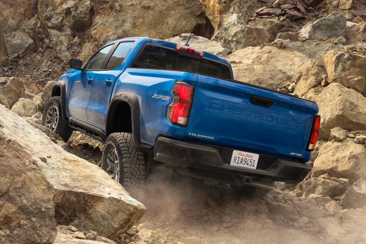 Blue Chevrolet Colorado ZR2 off-road truck Driving on a Rocky Terrain.