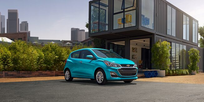 2022 Spark Small Hatchback Car parked outside a home.