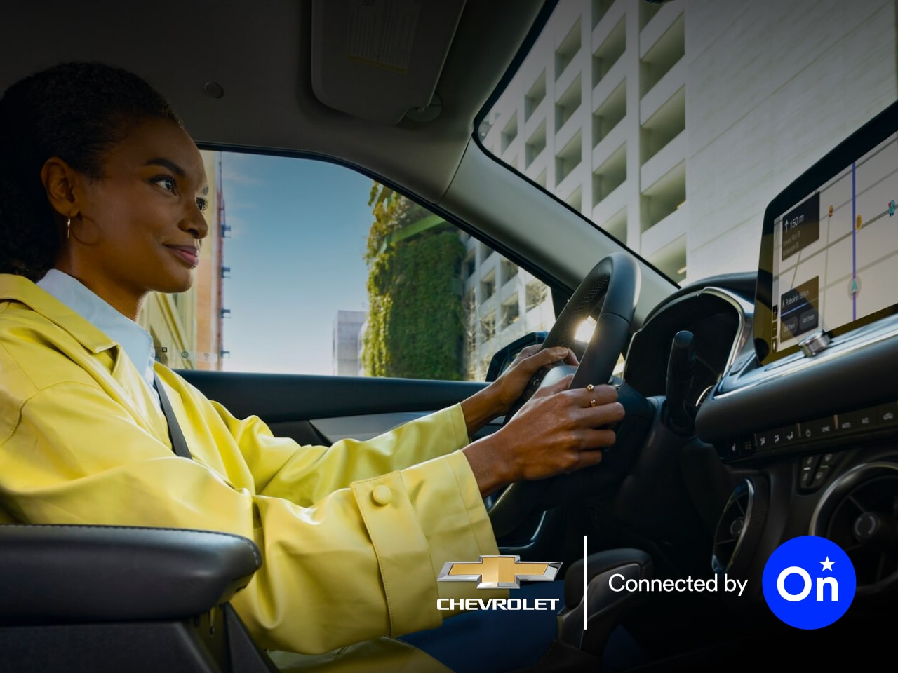 A person viewing Waze routes in the infotainment screen of an OnStar-subscribed GM vehicle.