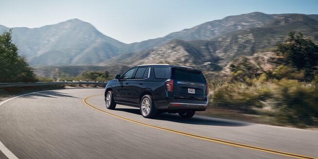 2022 Tahoe Full-Size SUV Exterior Rear Side View Driving.