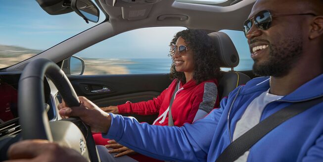 Two persons inside the 2024 Chevrolet Trax.