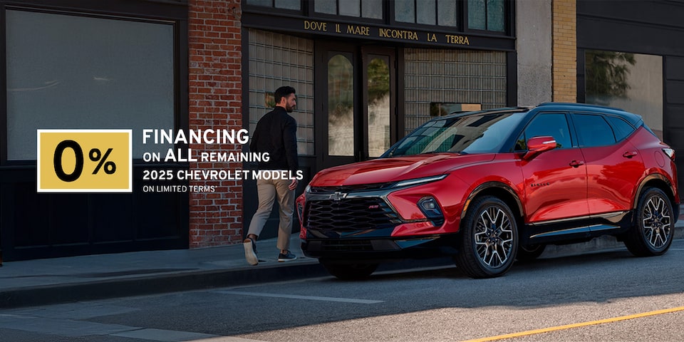 2025 Chevrolet Blazer parked beside a city building.
