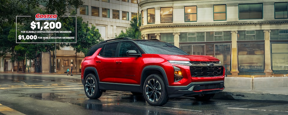2025 Chevrolet Equinox compact SUV parked alone on a city street on a rainy day.