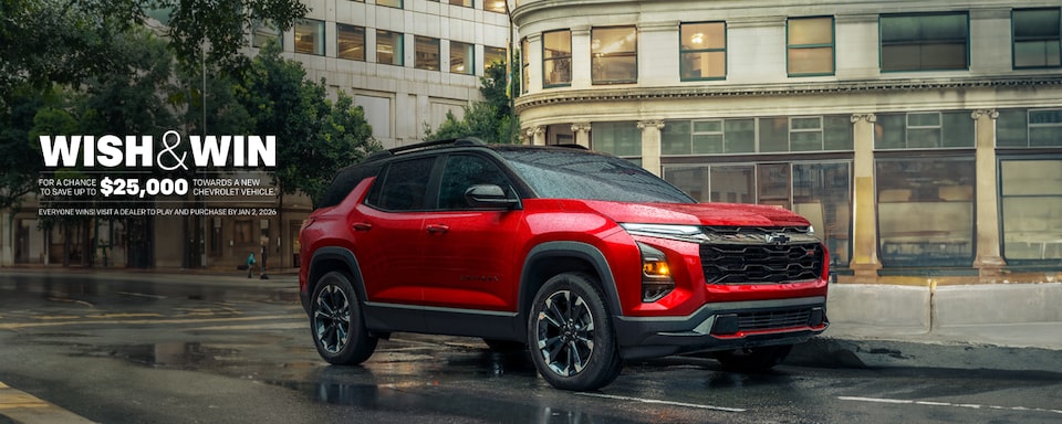 2025 Chevrolet Equinox compact SUV parked alone on a city street on a rainy day.