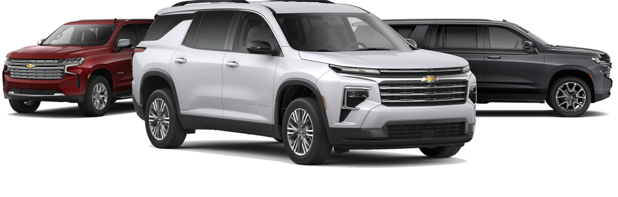 A lineup of three 2025 Chevrolet SUVs.
