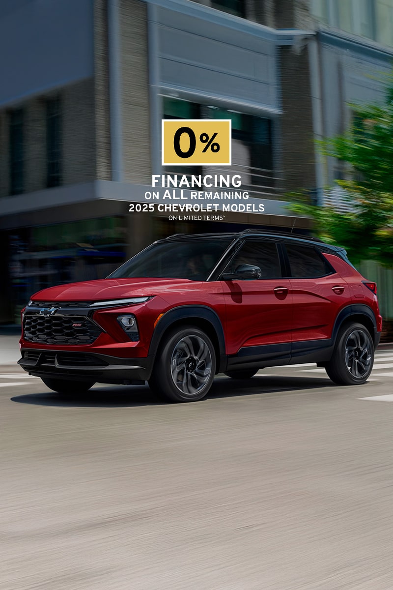 2025 Chevrolet Trailblazer driving through a city intersection.
