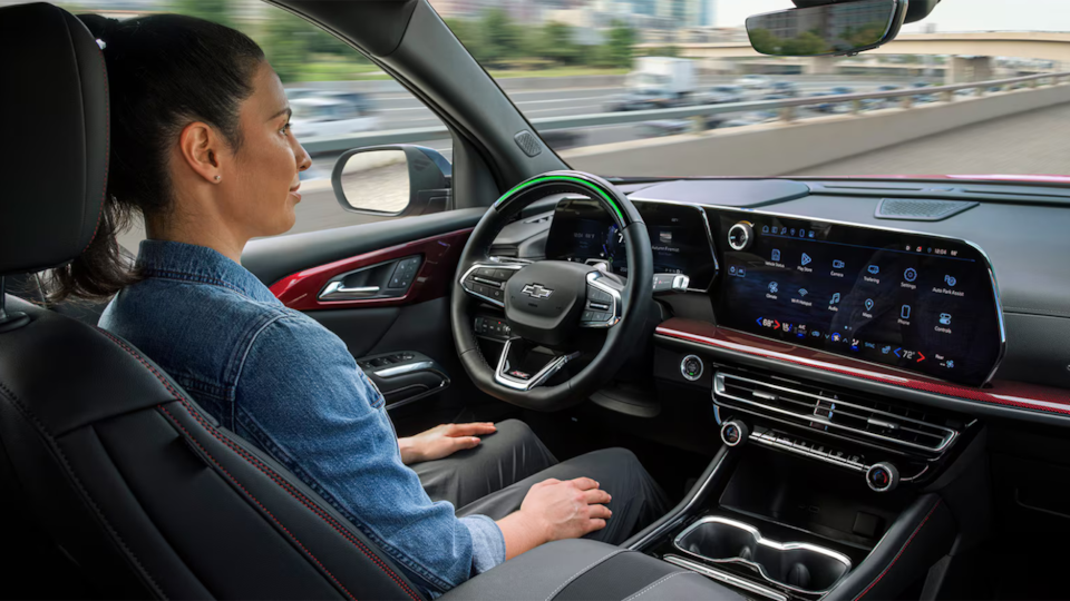 A person utilizing the Super Cruise Driver Assistance Technology in the 2025 Chevrolet Traverse SUV.