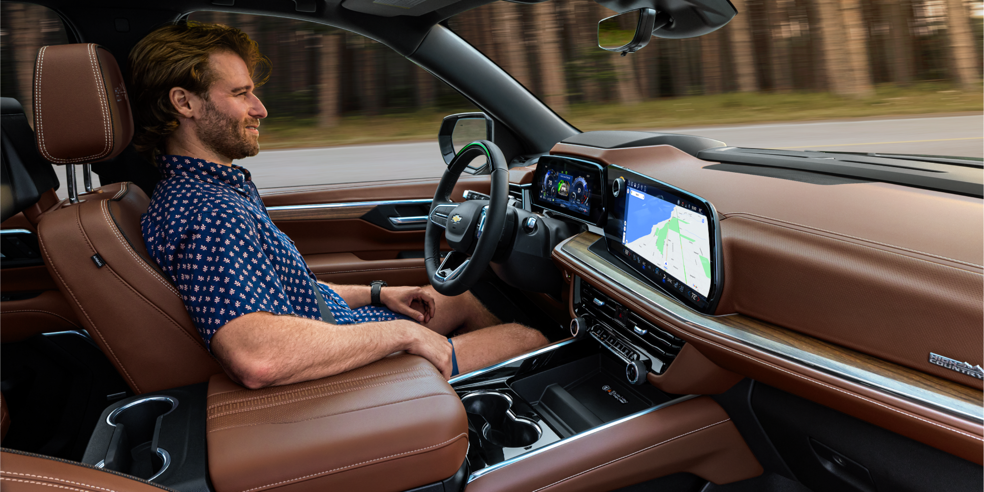 Side View a Person Utilizing the Super Cruise Driver Assistance Technology in the 2026 Chevrolet Suburban.