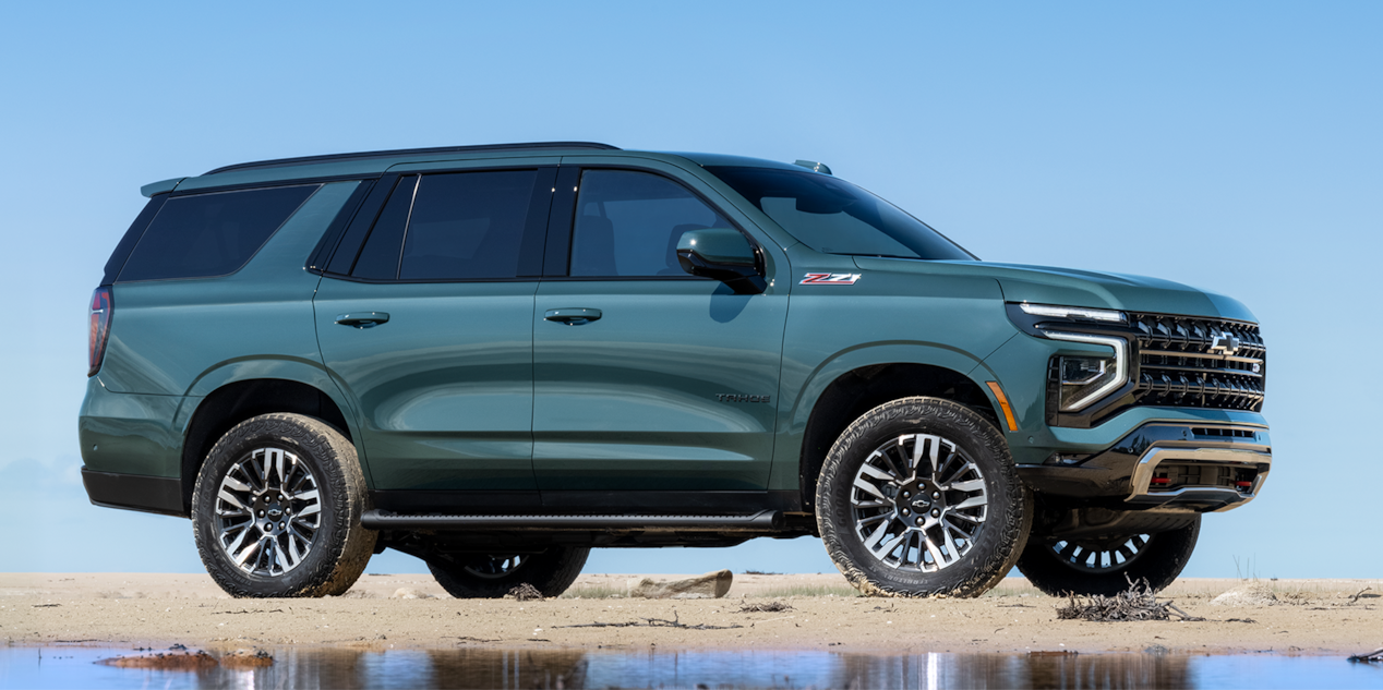 Side View of the 2026 Chevrolet Tahoe SUV Parked on a Sandy Beach.