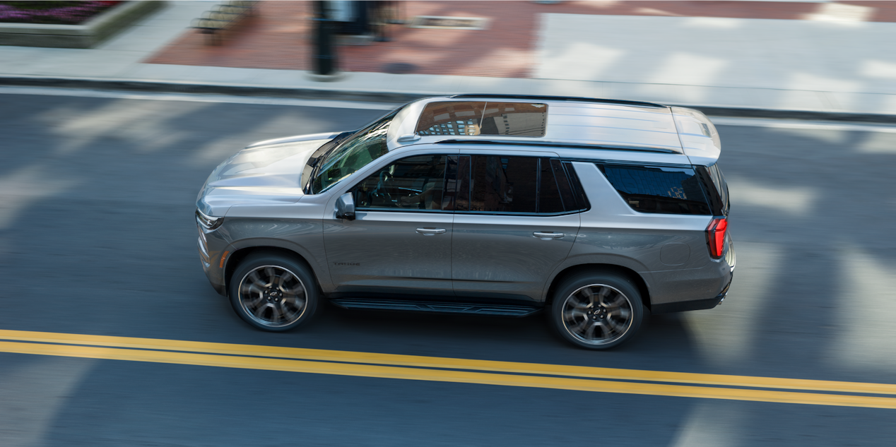 Bird's-eye View of the 2026 Chevrolet Tahoe Driving Down a Road.