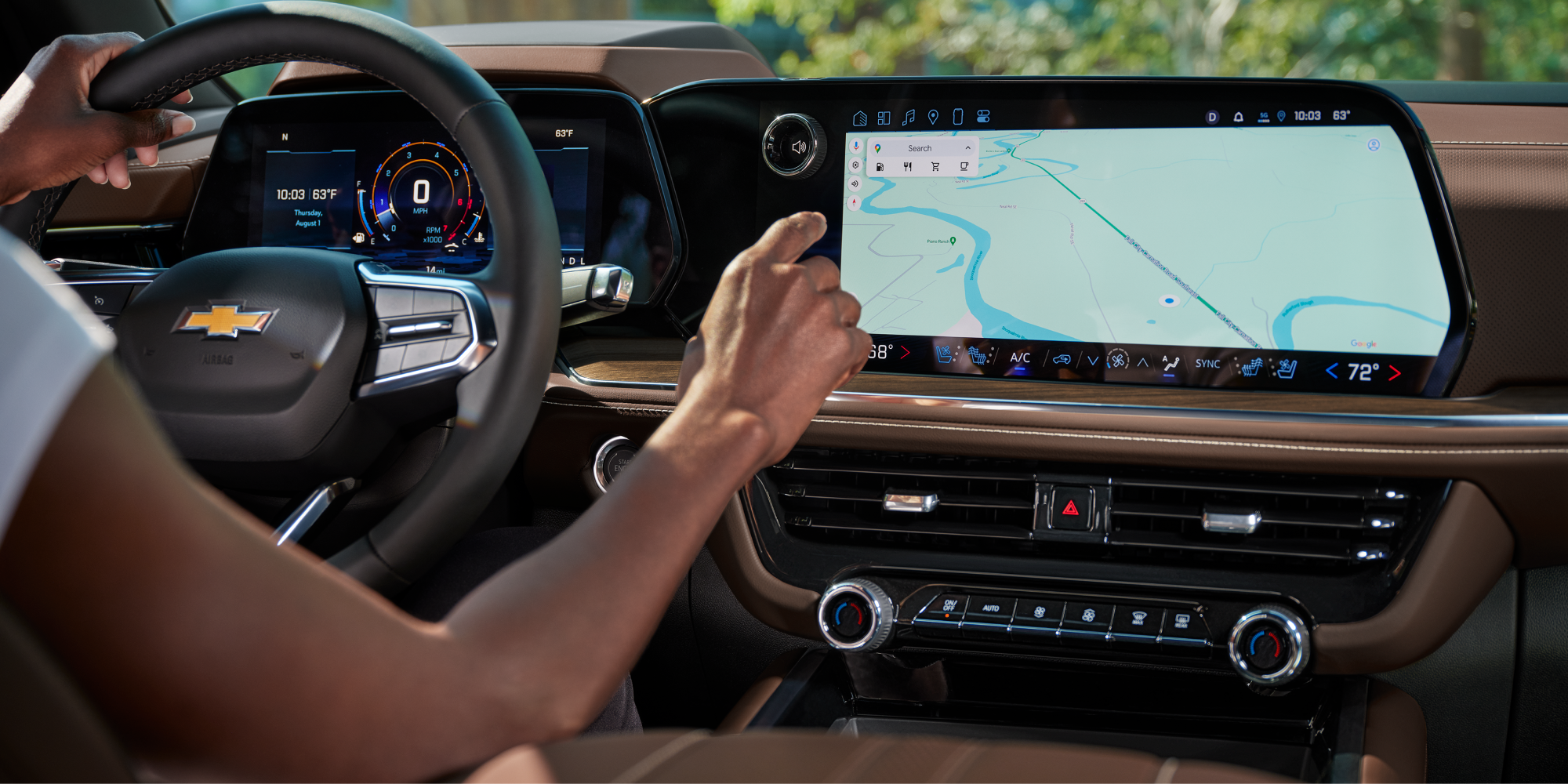A Person Setting Up the Navigation System on the Display Screen of the 2026 Chevrolet Tahoe.