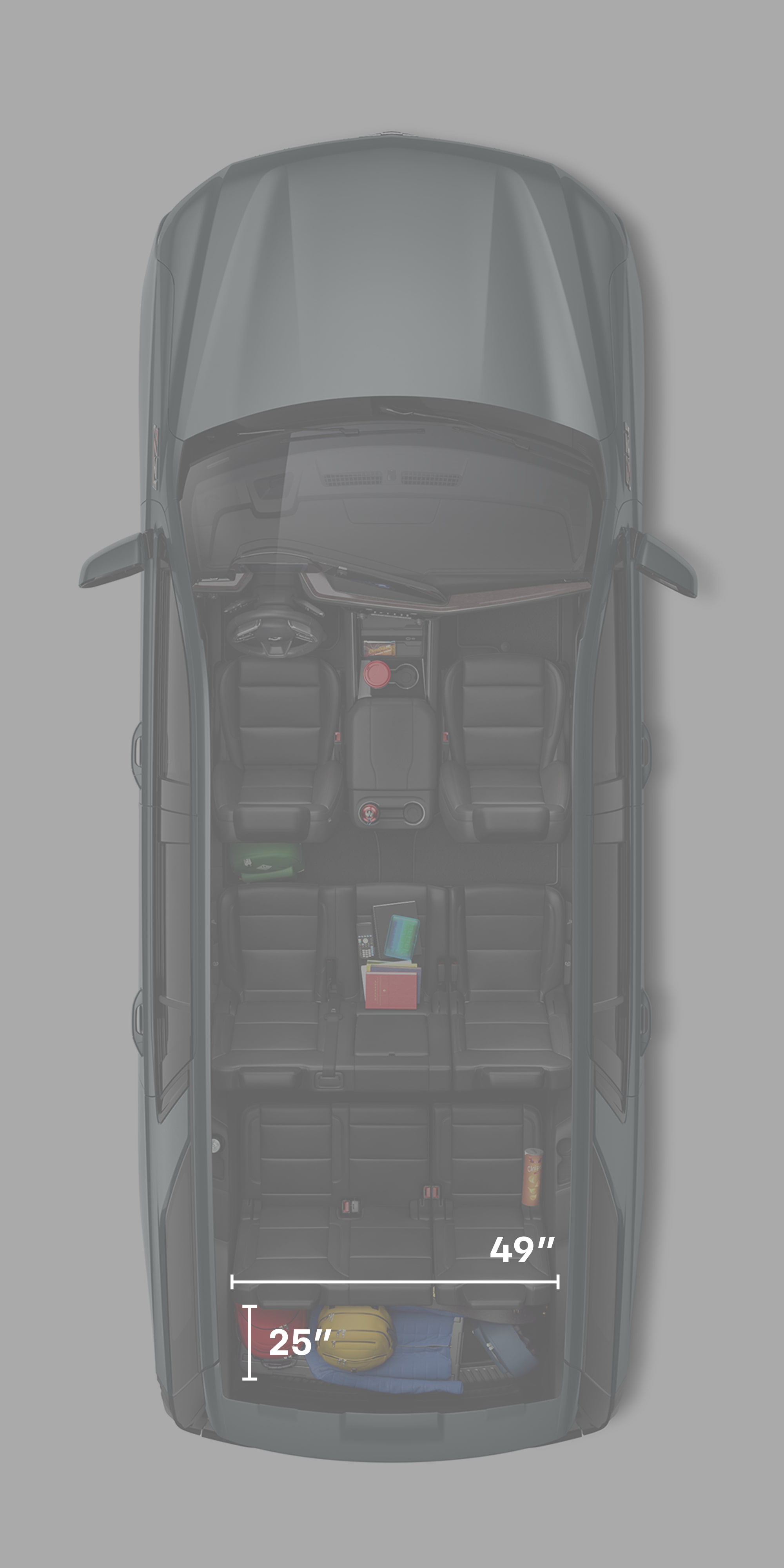 A Top View of the 2026 Chevrolet Tahoe Interior with Three Empty Rows and Backpacks in the Trunk.