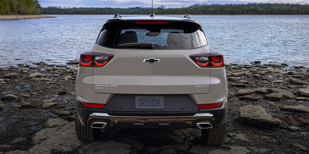 Back view of the 2026 Chevrolet Trailblazer ACTIV trim parked alone by a rocky shoreline.