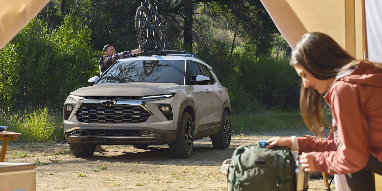 Two people preparing to enter the 2026 Chevrolet Trailblazer ACTIV trim.