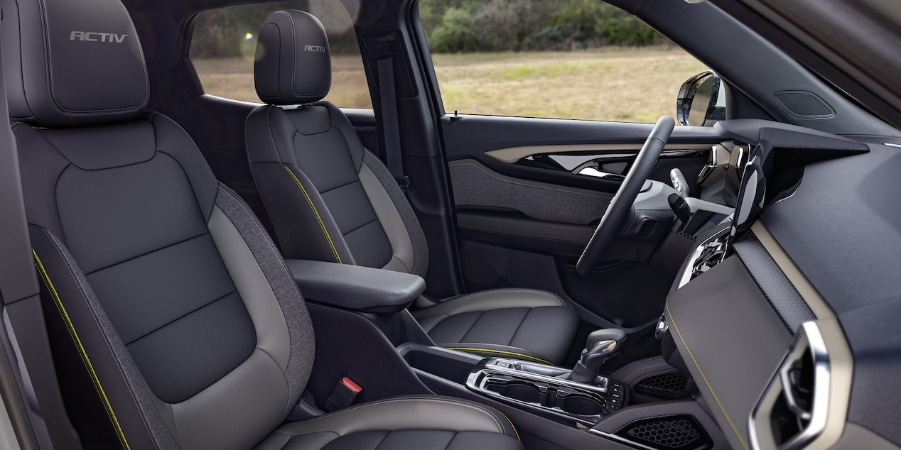 Side view of the jet black front interiors of the 2026 Chevrolet Trailblazer ACTIV trim.