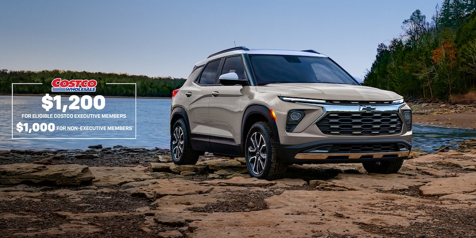 Front-side view of the 2026 Trailblazer ACTIV trim parked by a lake.
