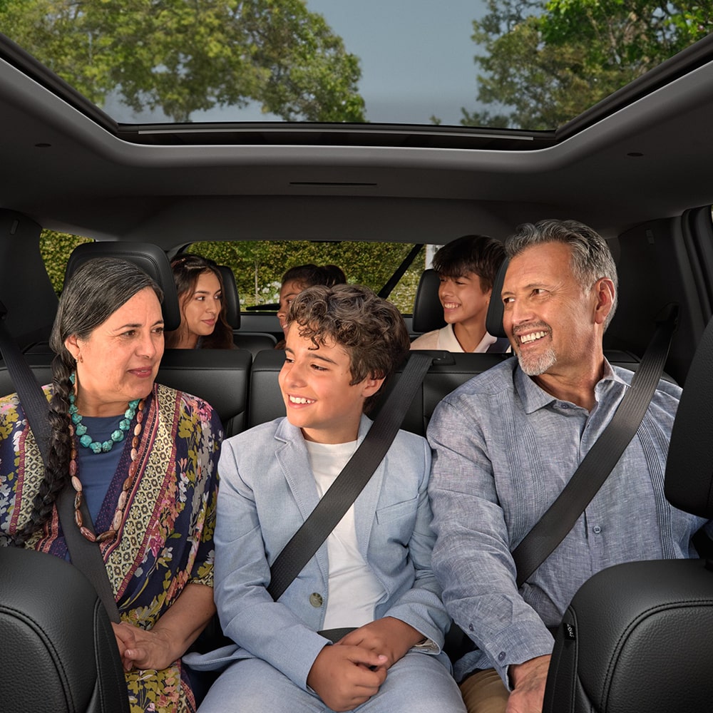 A Family Seated in all 3 Rows of the Spacious 2026 Chevrolet Traverse.