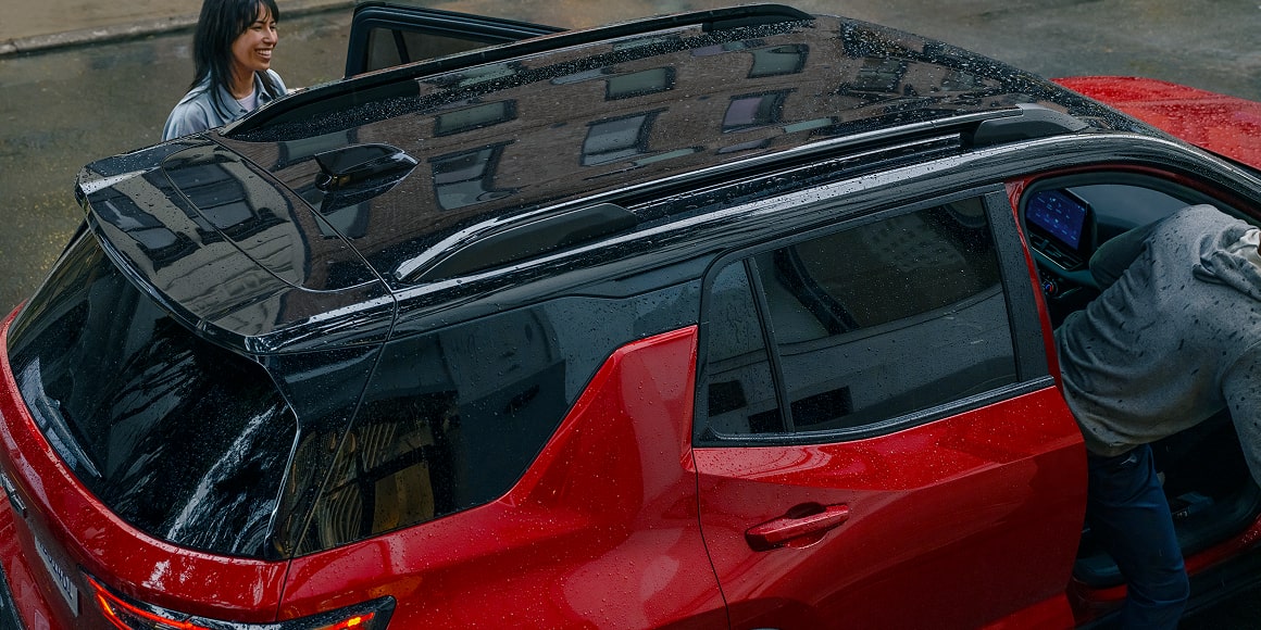 Close-up of the Roof and Exterior of a Red 2027 Chevrolet Equinox.