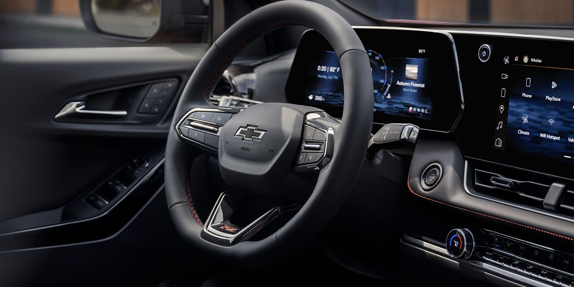 Close-up view of the steering wheel of the 2027 Chevrolet Equinox.
