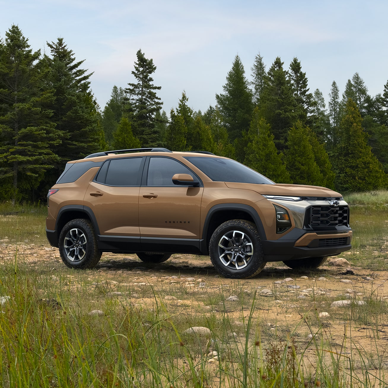 Profile View of a 2027 Chevrolet Equinox Parked in the Middle of an Open Area in the Woods.