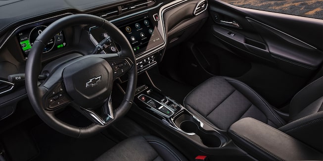 Interior of the 2023 Bolt EV showing off passenger seat and steering wheel.