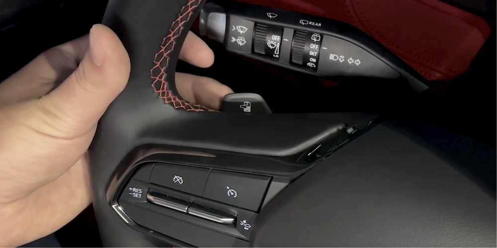 Close up view of a person using the Regen-On-Demand feature inside the Chevrolet Blazer EV.