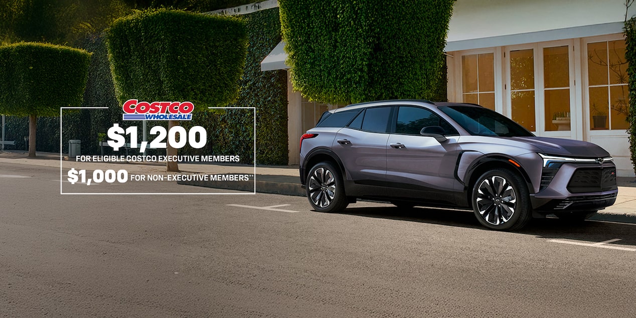 Side view of the 2026 Chevrolet Blazer EV parked near a lake.