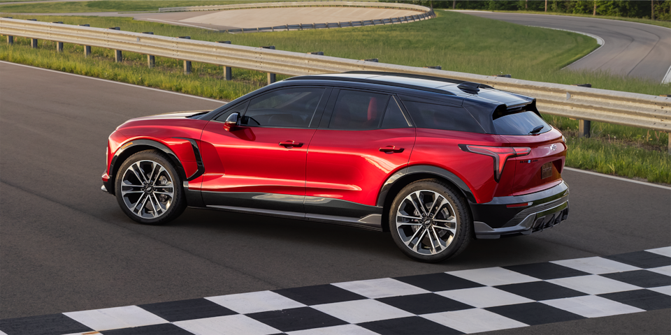 Side view of the 2025 Chevrolet Blazer EV parked on a race track.