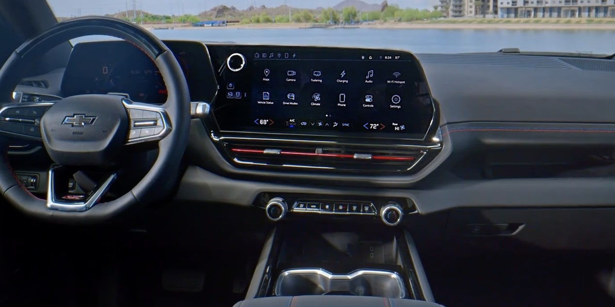 Front interior view of the 2025 Chevrolet Silverado EV parked under a clear blue sky.