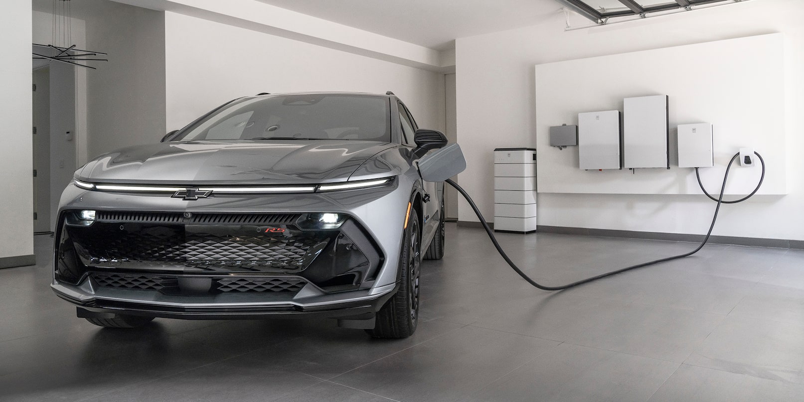 Official Chevrolet Canada image of a 2026 Equinox EV connected to a home charger