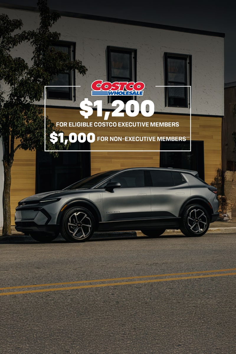 2026 Chevrolet Equinox EV side profile parked in front of a storefront