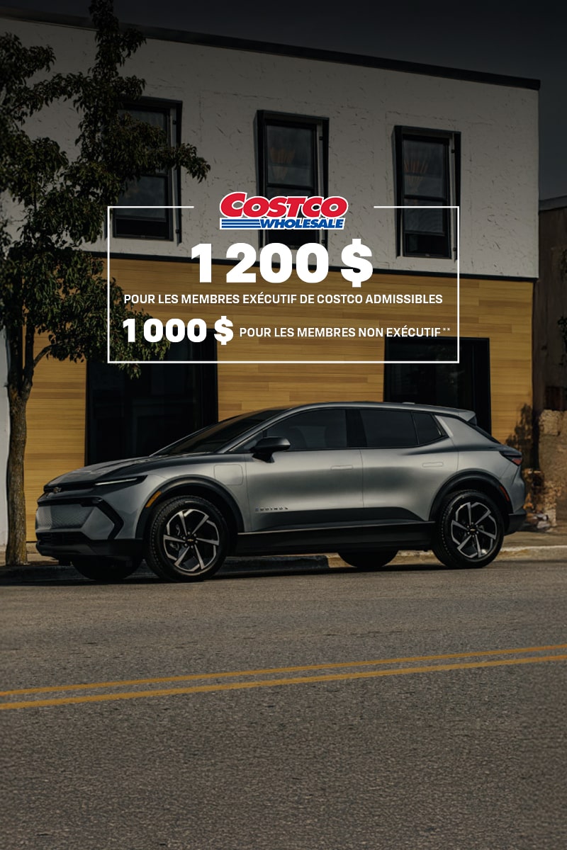 Profil latéral du Chevrolet Equinox EV 2026 stationné devant une vitrine.