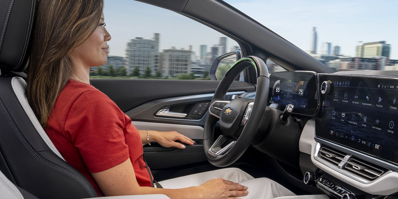 Woman Using Super Cruise  Hands Free Driving Feature