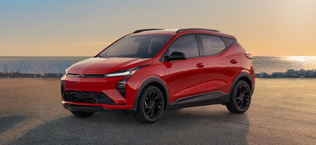 2027 Chevrolet Bolt RS in Habanero Solid on the beach