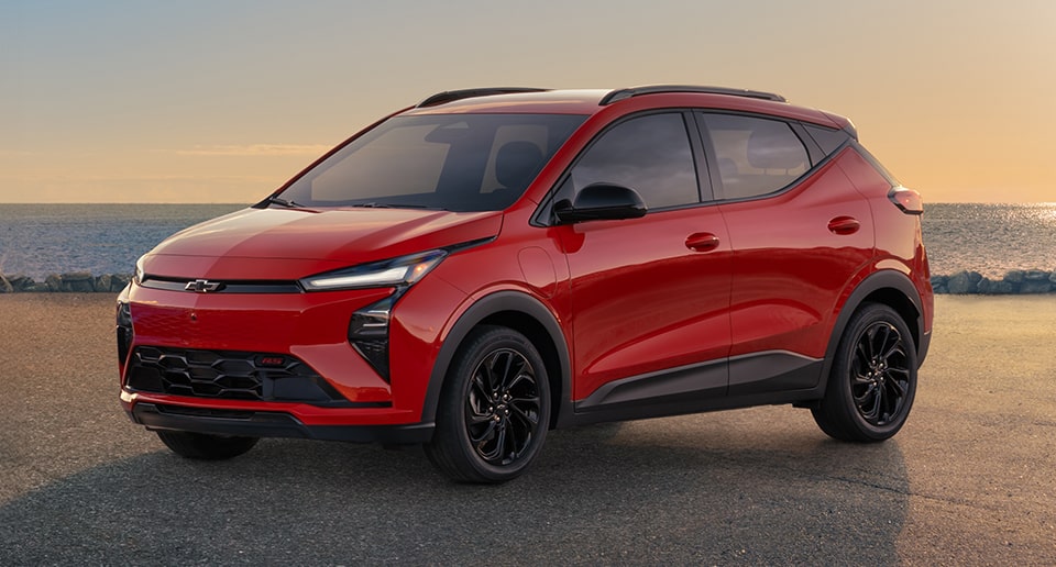 2027 Chevrolet Bolt RS in Habanero Solid on the beach