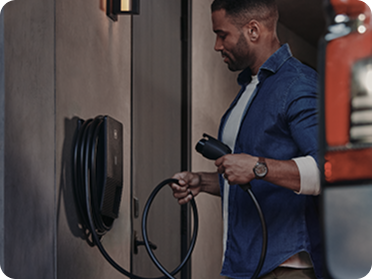A Man Holding an Chevrolet EV Charger Wall Mount