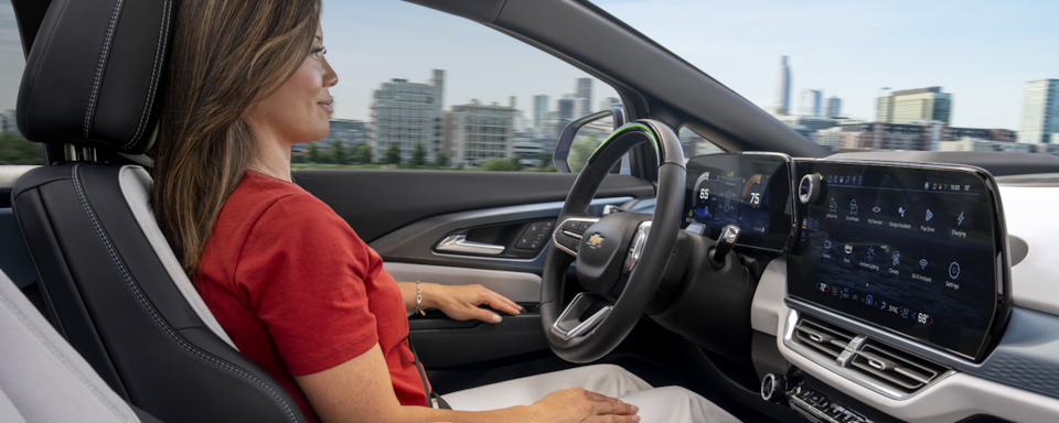 A person utilizing the Super Cruise feature inside a Chevrolet EV.