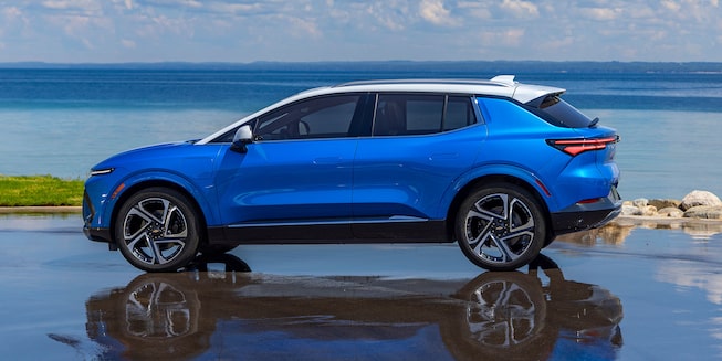 2024 Equinox EV Drivers Side Profile Shot on Reflective Surface